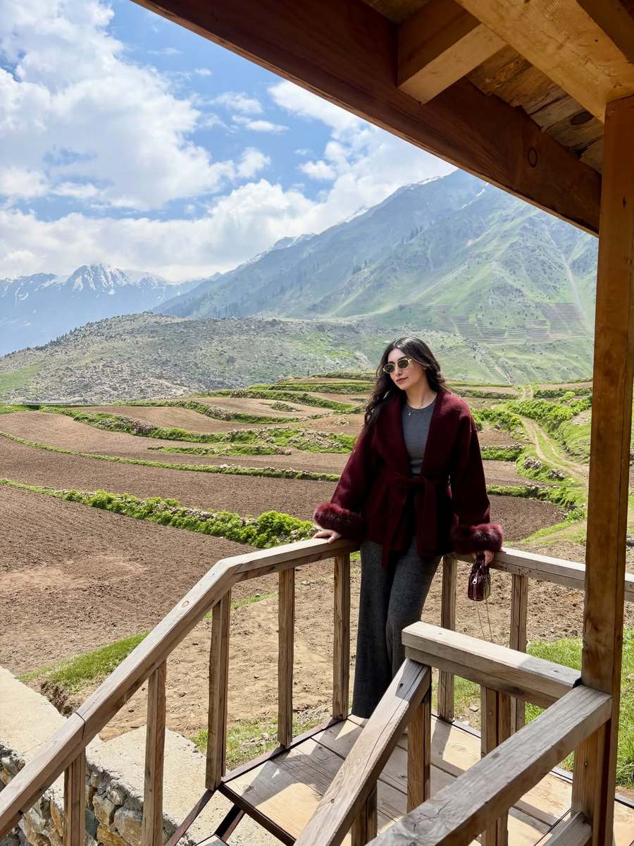 Customer in the burgundy cardigan with faux fur cuffs