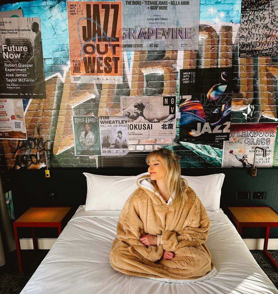 Customer in the beige oversized hoodie blanket