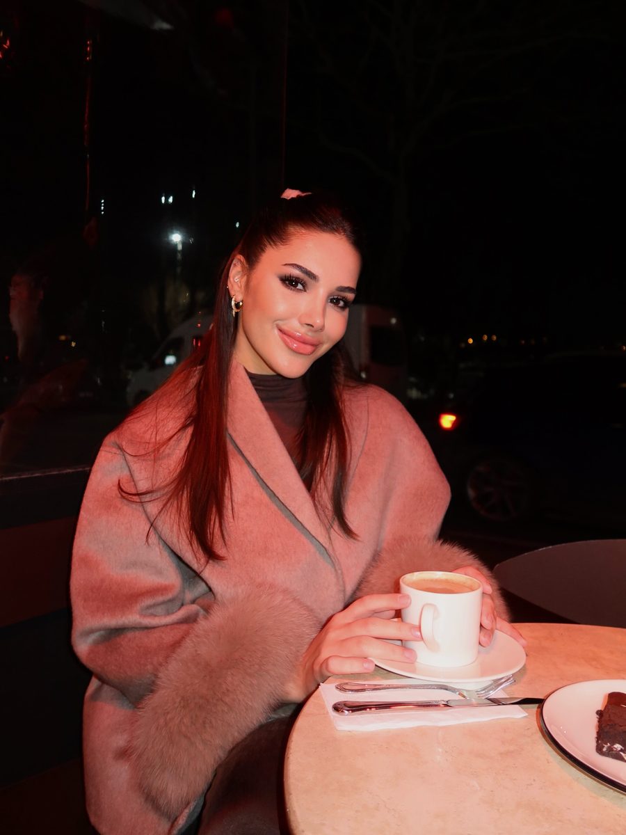 Customer in the pink coat with faux fur cuffs